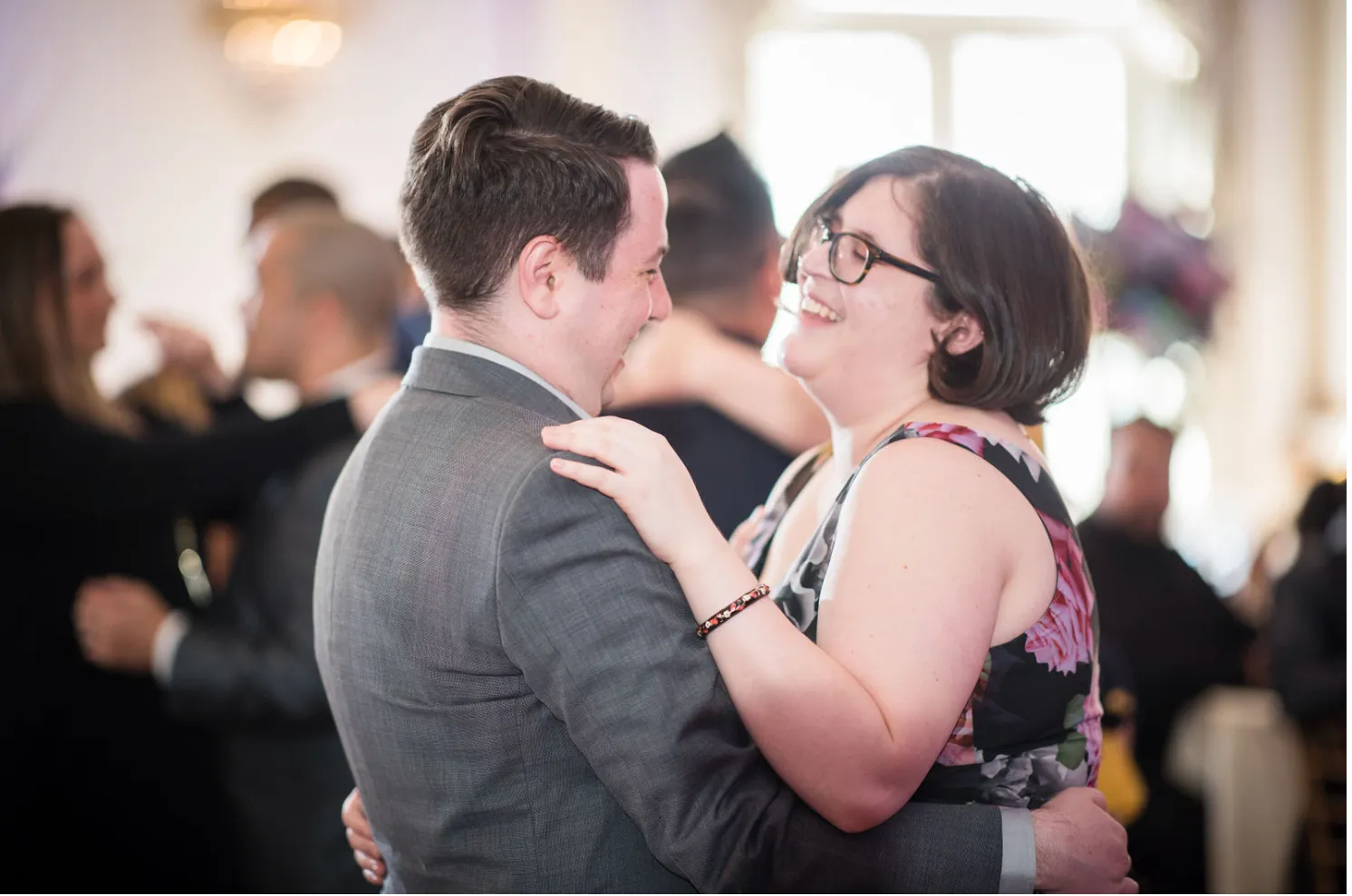 Eli and his partner at a wedding